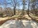 Backyard featuring a concrete patio and mature trees at 1740 Berry Ct, Cumming, GA 30041