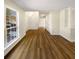 Hallway with natural light, wood-look floors, and views of the staircase and entryway at 1740 Berry Ct, Cumming, GA 30041