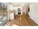 Modern kitchen with stainless steel appliances, granite countertops, and a view of the wooded property at 1740 Berry Ct, Cumming, GA 30041