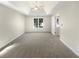 Main bedroom with plush carpeting, a trey ceiling, and ample natural light at 1740 Berry Ct, Cumming, GA 30041