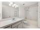 Bright bathroom featuring a tile vanity, and bath with shower at 2700 Pine Tree Ne Rd # 3010, Atlanta, GA 30324