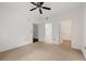 Bedroom featuring neutral carpet, ceiling fan and ensuite bathroom access at 2700 Pine Tree Ne Rd # 3010, Atlanta, GA 30324