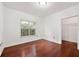 A bedroom with hardwood floors, a window, and a closet at 2700 Pine Tree Ne Rd # 3010, Atlanta, GA 30324