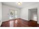 Dining room featuring hardwood floors, neutral walls, classic trim, and doors to a balcony at 2700 Pine Tree Ne Rd # 3010, Atlanta, GA 30324