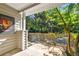 A view of a covered patio with an iron fence overlooking a wooded area at 2700 Pine Tree Ne Rd # 3010, Atlanta, GA 30324