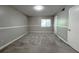 Bedroom with new carpet, fresh paint, ample natural light, a closet, and a large window at 3020 Wingate Way, Sandy Springs, GA 30350