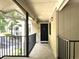 A condo entryway featuring a black door and a view of the surrounding neighborhood at 3020 Wingate Way, Sandy Springs, GA 30350