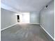 View of the carpeted living room with fresh paint and a doorway leading into the next room at 3020 Wingate Way, Sandy Springs, GA 30350