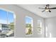 Bright bedroom featuring multiple windows, a ceiling fan, and neutral tones creating a serene and inviting atmosphere at 320 Gray Shingle Ln, Woodstock, GA 30189