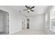 Spacious bedroom with ceiling fan, neutral walls, and adjoining bathroom and walk-in closet, offering comfort and convenience at 320 Gray Shingle Ln, Woodstock, GA 30189