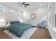 Cozy bedroom featuring hardwood floors, natural light, and a light blue color scheme at 320 Gray Shingle Ln, Woodstock, GA 30189