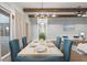 Dining room with hardwood floors, beamed ceilings and sliding doors to outdoor patio at 320 Gray Shingle Ln, Woodstock, GA 30189