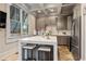 Modern kitchen with stainless steel appliances, marble countertops, and a large window providing natural light at 320 Gray Shingle Ln, Woodstock, GA 30189