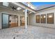 View of a brick patio featuring views of the interior living room, kitchen, and exterior windows at 320 Gray Shingle Ln, Woodstock, GA 30189