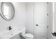 Chic powder room featuring a modern sink, updated fixtures, and a stylish mirror, providing a touch of luxury for guests at 320 Gray Shingle Ln, Woodstock, GA 30189