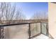 Balcony view with frosted glass railing overlooks winter trees at 335 W Ponce De Leon Ave # 506, Decatur, GA 30030