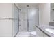 Bathroom featuring glass-enclosed shower and granite vanity at 335 W Ponce De Leon Ave # 506, Decatur, GA 30030