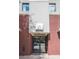 Building entrance featuring brick facade, frosted glass doors, and a modern sign with the address at 335 W Ponce De Leon Ave # 506, Decatur, GA 30030