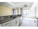 This bright kitchen features granite counters, stainless steel appliances, and white cabinets at 335 W Ponce De Leon Ave # 506, Decatur, GA 30030