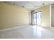 Living area featuring polished floors, concrete ceilings, modern fixtures, and a sliding door to balcony at 335 W Ponce De Leon Ave # 506, Decatur, GA 30030