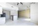 Open living space with a modern kitchen and exposed concrete pillars at 335 W Ponce De Leon Ave # 506, Decatur, GA 30030