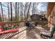 Relaxing back deck with patio furniture surrounded by trees, perfect for outdoor living at 3640 Shelby Ln, Marietta, GA 30062