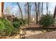 Backyard showing various greenery with a glimpse of the wooden back deck at 3640 Shelby Ln, Marietta, GA 30062