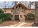 Charming house featuring a stone facade, a cozy front porch, and a stone pathway that leads to the entrance at 3640 Shelby Ln, Marietta, GA 30062