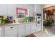 Efficient kitchen with white cabinetry, tile backsplash, and vintage oven at 3640 Shelby Ln, Marietta, GA 30062