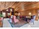 Inviting living room featuring wood paneled walls, cozy seating, and ample natural light at 3640 Shelby Ln, Marietta, GA 30062