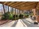 Covered back patio with a seating arrangement and view of the backyard landscaping at 3640 Shelby Ln, Marietta, GA 30062