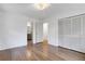 Bright bedroom with hardwood floors, closet, and a bathroom at 4169 Cedar Valley Ln, Conley, GA 30288