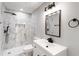 Modern bathroom featuring marble-look tile, black hardware and a sleek vanity at 190 Clydesdale Se Ln, Mableton, GA 30126