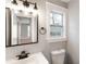 Bathroom featuring a gray-framed mirror and a white vanity at 190 Clydesdale Se Ln, Mableton, GA 30126