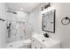 Modern bathroom featuring marble-look tile, black hardware and vanity at 190 Clydesdale Se Ln, Mableton, GA 30126