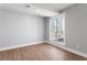 Bedroom featuring wood-look floors and a light-filled window at 190 Clydesdale Se Ln, Mableton, GA 30126