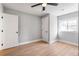 Bright bedroom with a modern ceiling fan and wood-look floors and dual closets at 190 Clydesdale Se Ln, Mableton, GA 30126