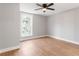 A bright bedroom is well-lit by a window and ceiling fan at 190 Clydesdale Se Ln, Mableton, GA 30126