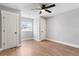 Bright bedroom with a modern ceiling fan and wood-look floors and dual closets at 190 Clydesdale Se Ln, Mableton, GA 30126