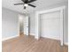 This airy bedroom features vinyl floors, light-gray walls, and a large closet at 190 Clydesdale Se Ln, Mableton, GA 30126