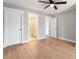 Spacious bedroom featuring vinyl floors, light-gray walls, ceiling fan, and an ensuite bath with a marble shower at 190 Clydesdale Se Ln, Mableton, GA 30126