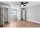 Bright bedroom with a modern ceiling fan, wood-look floors and dual closets at 190 Clydesdale Se Ln, Mableton, GA 30126