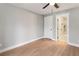 Bright bedroom featuring vinyl floors, light-gray walls, ceiling fan, and access to an ensuite bath with a marble shower at 190 Clydesdale Se Ln, Mableton, GA 30126