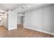 Hallway with wood-look flooring leads to a well-lit bathroom and an open doorway at 190 Clydesdale Se Ln, Mableton, GA 30126