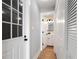 Hallway featuring an entry door and a view of the bathroom at 190 Clydesdale Se Ln, Mableton, GA 30126