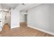 Hallway featuring wood-look flooring leads to a well-lit bathroom at 190 Clydesdale Se Ln, Mableton, GA 30126