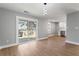 Light filled Living Room leading to Kitchen and outdoor deck with sliding glass doors and luxury floors at 190 Clydesdale Se Ln, Mableton, GA 30126