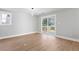 Light filled Living Room leading to outdoor deck with sliding glass doors and luxury floors at 190 Clydesdale Se Ln, Mableton, GA 30126