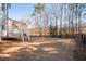 Expansive backyard with walk out deck, stairs to grade, and fenced perimeter at 2038 Cresthaven Walk, Woodstock, GA 30189