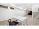 Finished basement area with desk and chair, with recessed lights and staircase at 2038 Cresthaven Walk, Woodstock, GA 30189